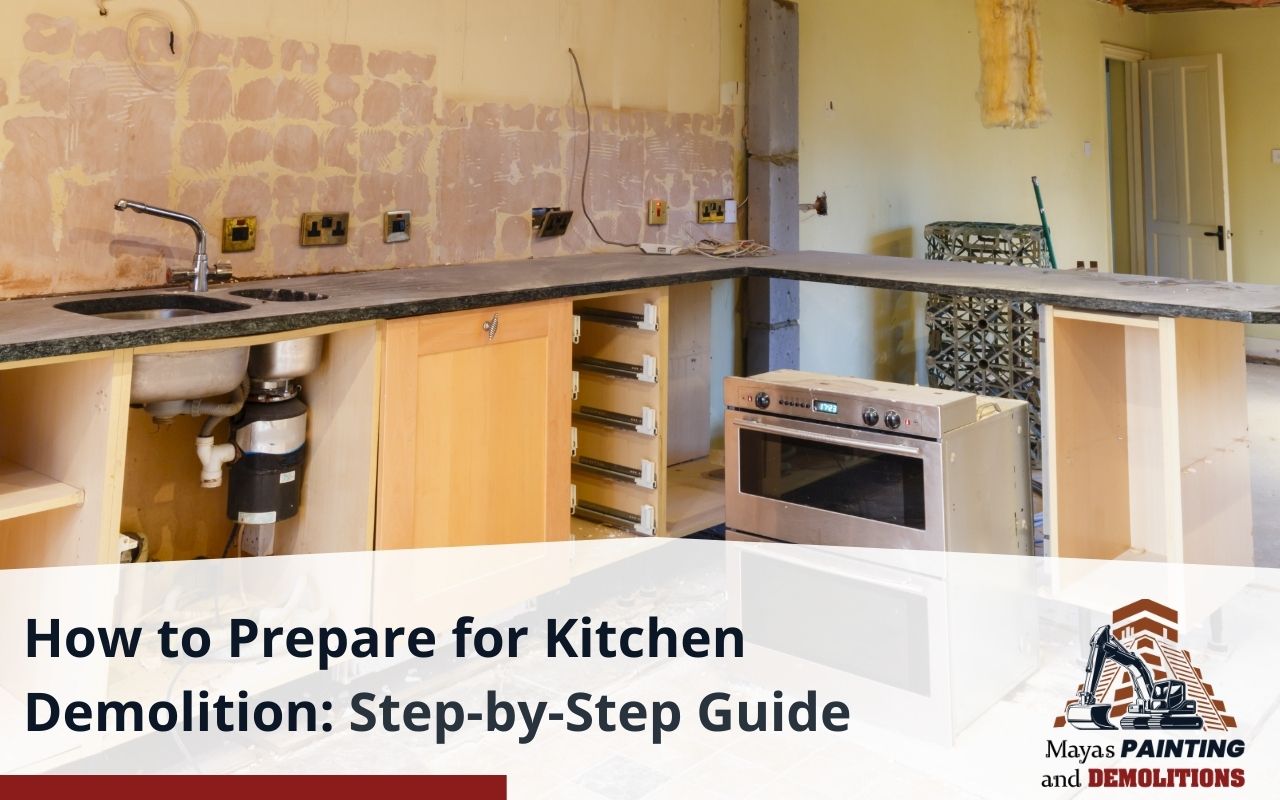 Homeowner preparing kitchen for demolition with tools and plastic covers.
