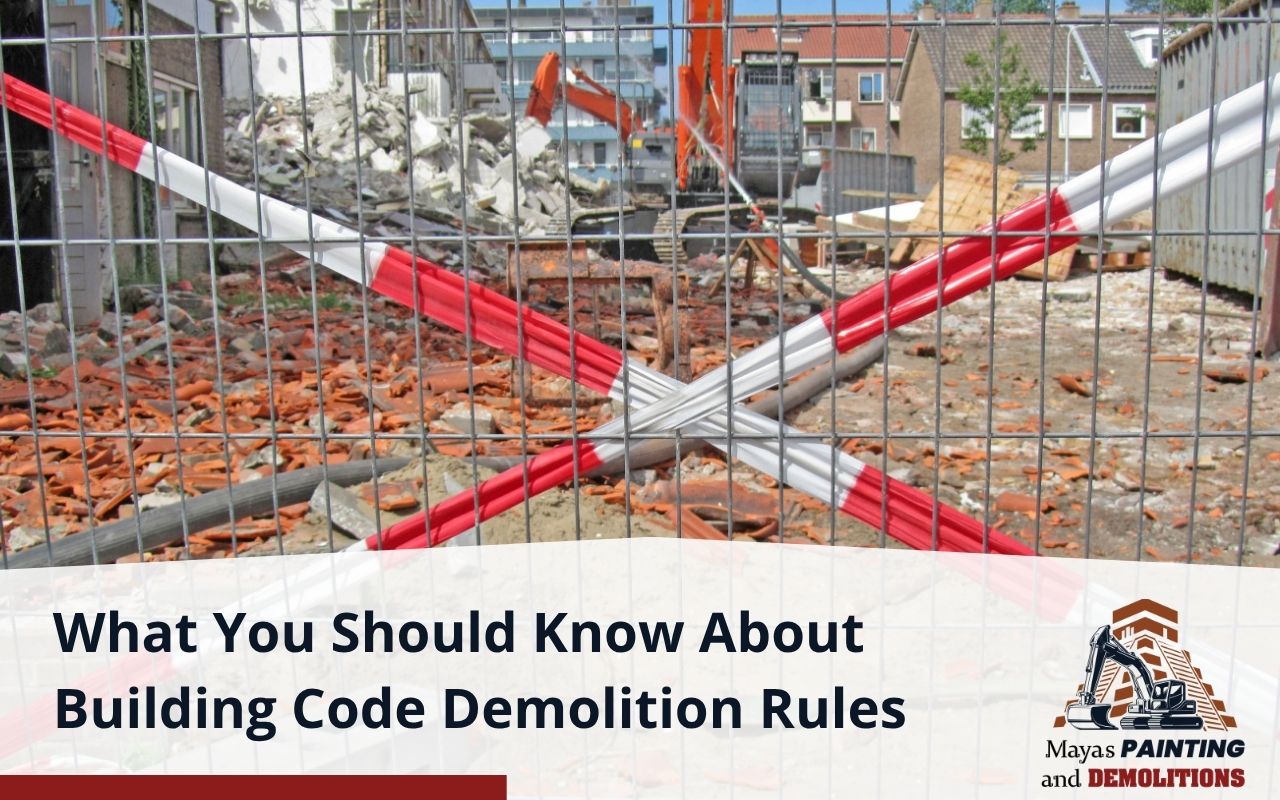 Residential demolition site with fencing and warning signs
