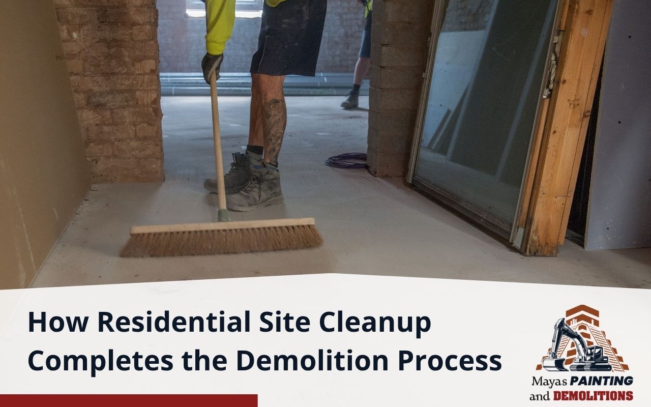 Contractor loading debris into a dumpster after demolition